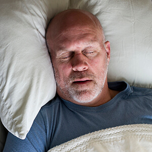 Sparks Sleep Apnea Therapy man in soundly sleeping