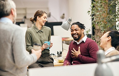 coworkers having a conversation in an office