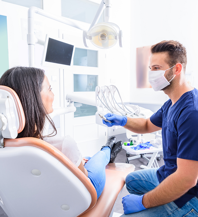 Dentist preparing to treat a patient