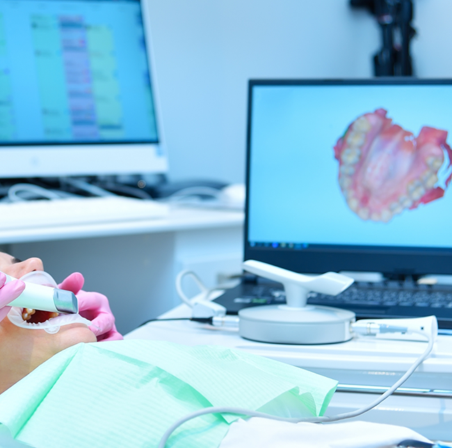 Dental patient having digital scans of her teeth taken