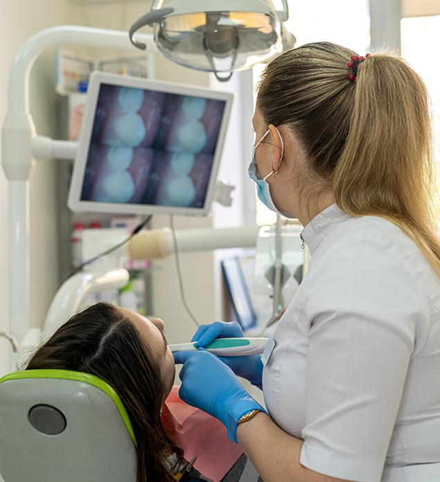 Dentist capturing close up photos of a patient's teeth