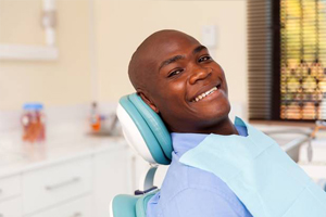 Smiling man in dental chair