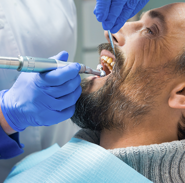 Man getting a dental checkup and cleaning in Sparks