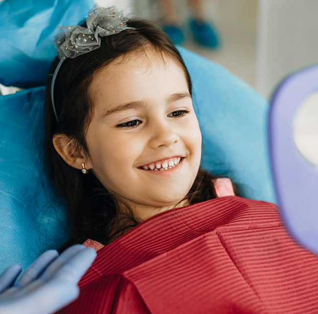 Young girl smiling in the dental chair