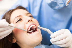 Woman receiving teeth whitening