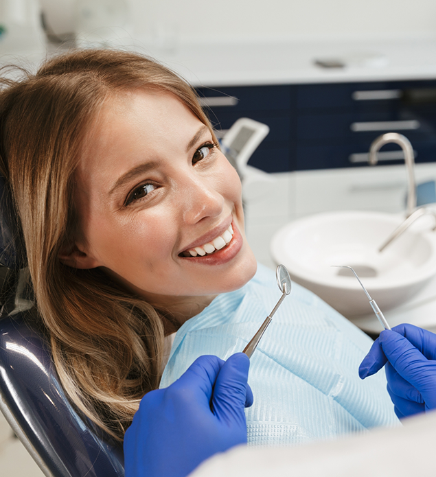 Woman smiling during her dental checkup
