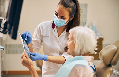 Dentist showing a senior patient her x-rays