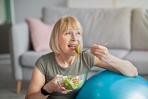 Woman eating salad