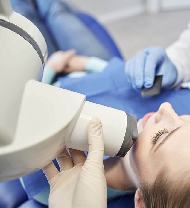 Woman getting x-rays of her teeth taken