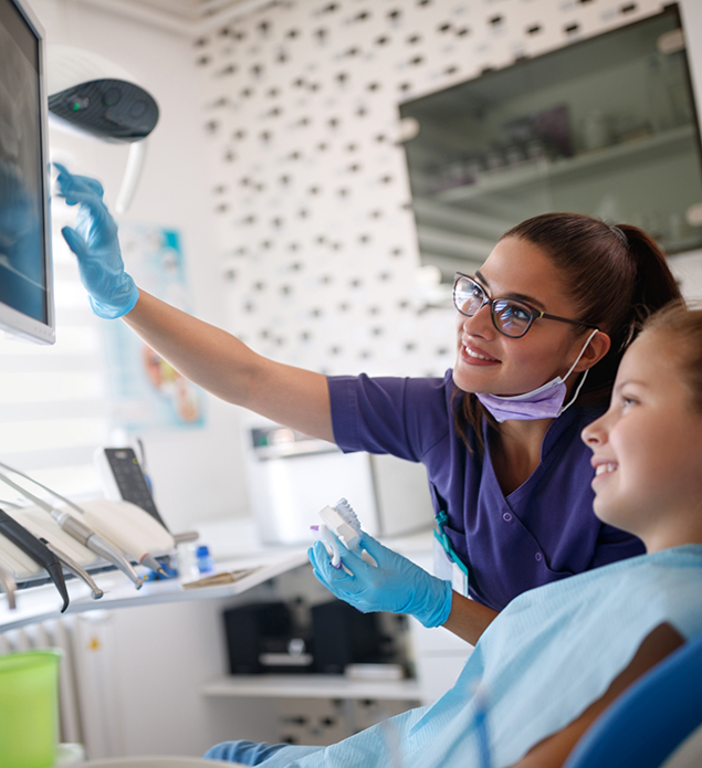 Dentist showing a patient an x-ray of their teeth