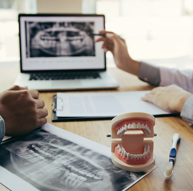 Emergency dentist in Sparks showing a patient an x-ray of their teeth