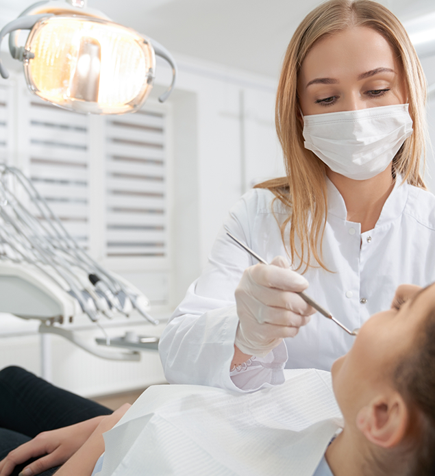 Dentist examining a patient's teeth