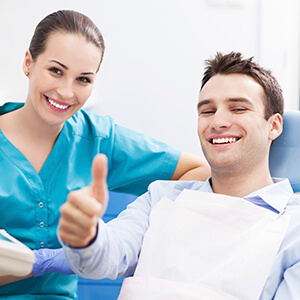 Pleased Male patient giving an enthusiastic thumbs up