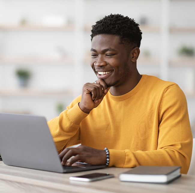 Man using a laptop at a table