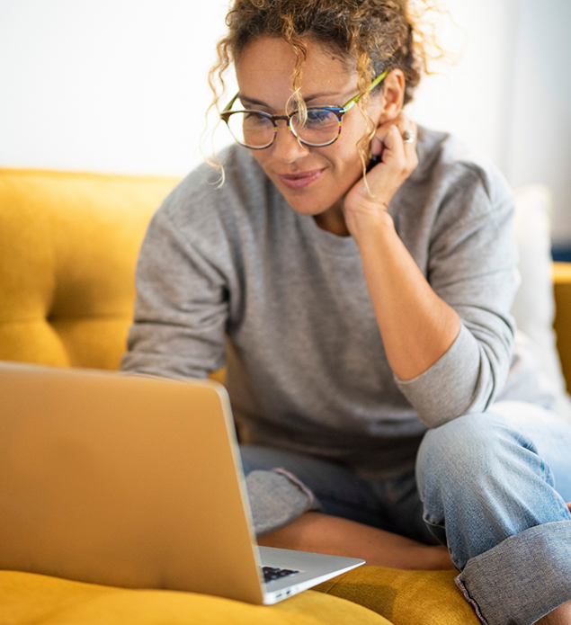 Woman using a laptop at home