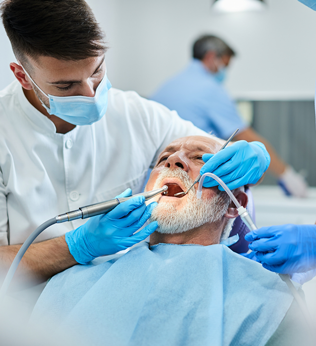 Senior man receiving a dental cleaning