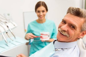 Senior man smiling in dental chair