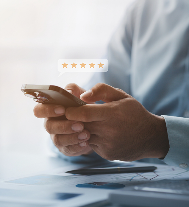 Person writing a five star review on their phone