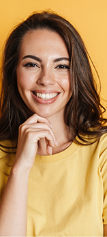 Smiling woman in a yellow shirt