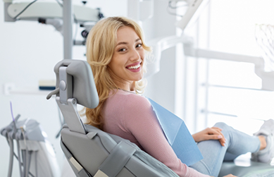 Blonde woman smiling in the dental chair