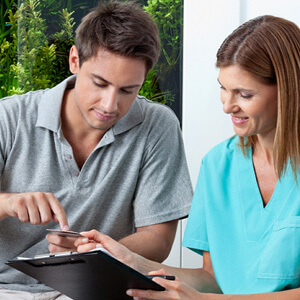 patient talking to a dentist about money