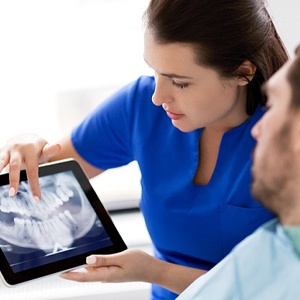 dentist showing patient their X-Rays