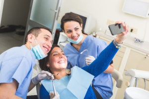 woman taking selfie with dentist