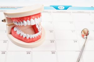 dental tools on calendar