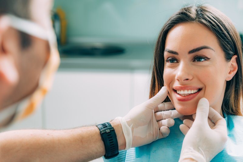 Woman smiling with cosmetic dentist