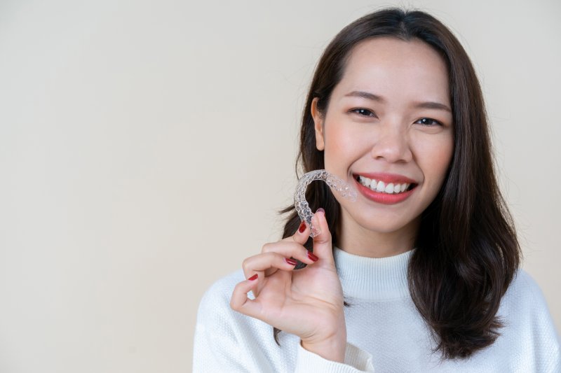 woman smiling with her SureSmile in Sparks