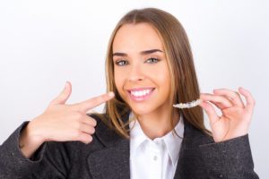 businesswoman with clear aligners 